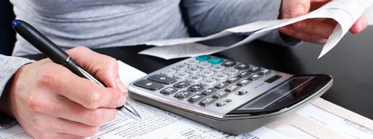 A person fills out tax forms to get a deduction on their vehicle.