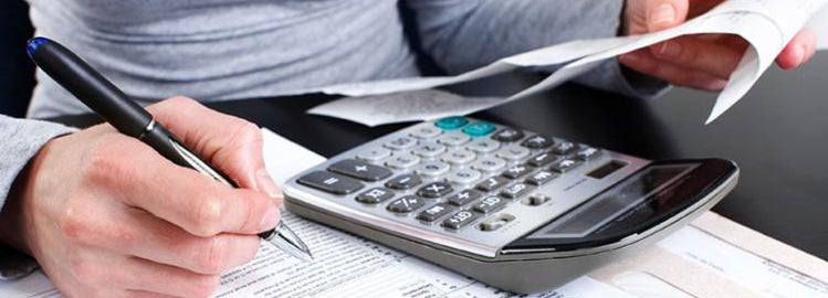 A person fills out tax forms to get a deduction on their vehicle.