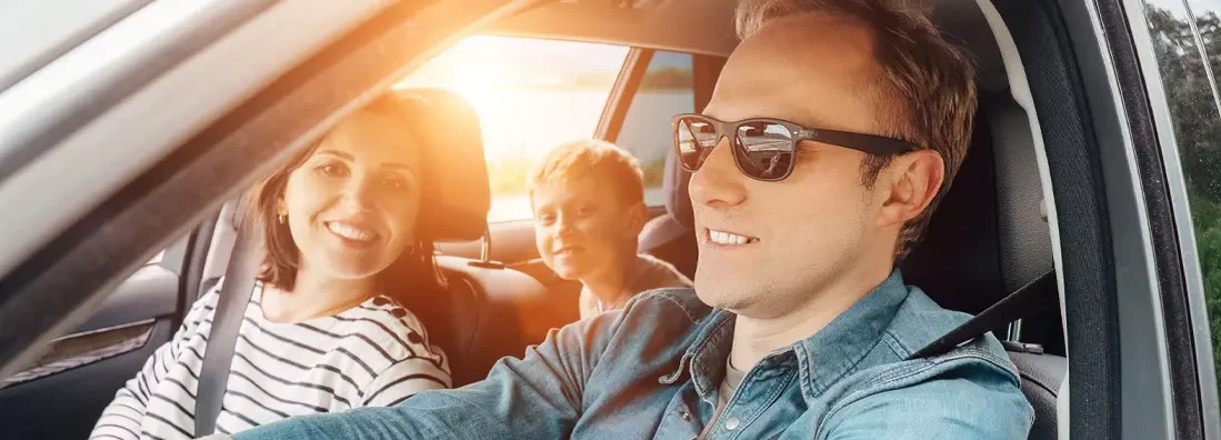 Family driving in the car. Find Lexington, Kentucky car insurance.
