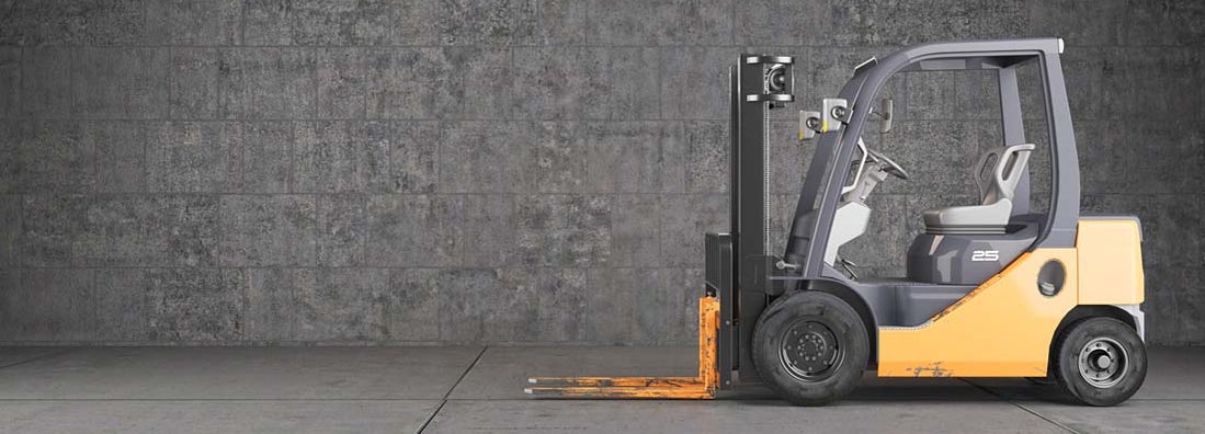 Forklift truck standing on industrial concrete wall background. Find Forklift Insurance.
