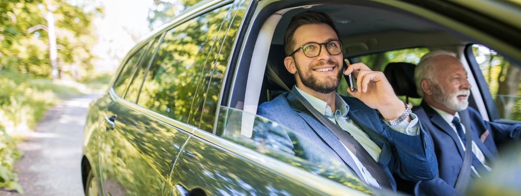 Businessmen on a business trip in nature. Find Syracuse New York car insurance.