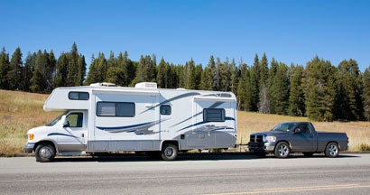 RV motorhome in Yellowstone National Park, Wyoming. The 5 Best Cars to Tow behind an RV. 