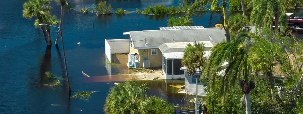 Surrounded by hurricane Ian rainfall flood waters homes in Florida residential area. What is a flood zone?