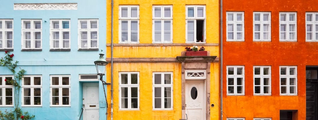 Photo of colorful townhouses in downtown. What insurance do I need to start a business?