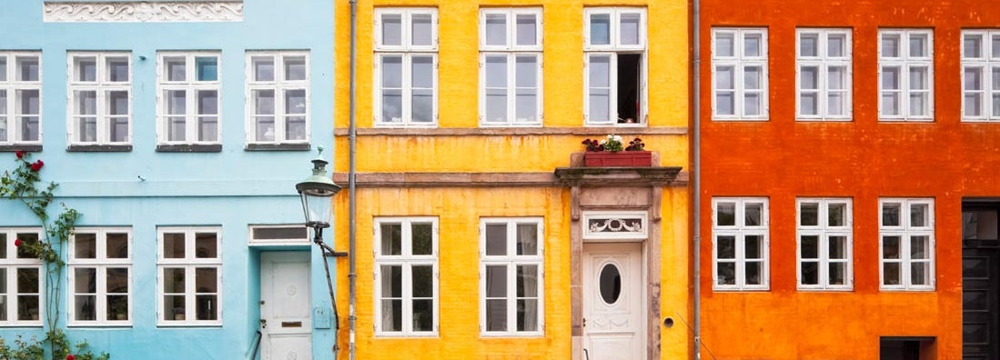 Photo of colorful townhouses in downtown. What insurance do I need to start a business?