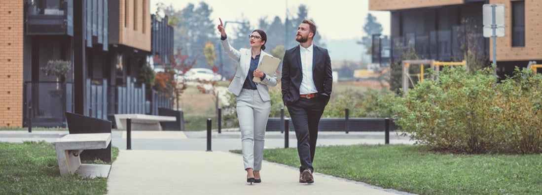 Property manager and customer looking at apartments.
