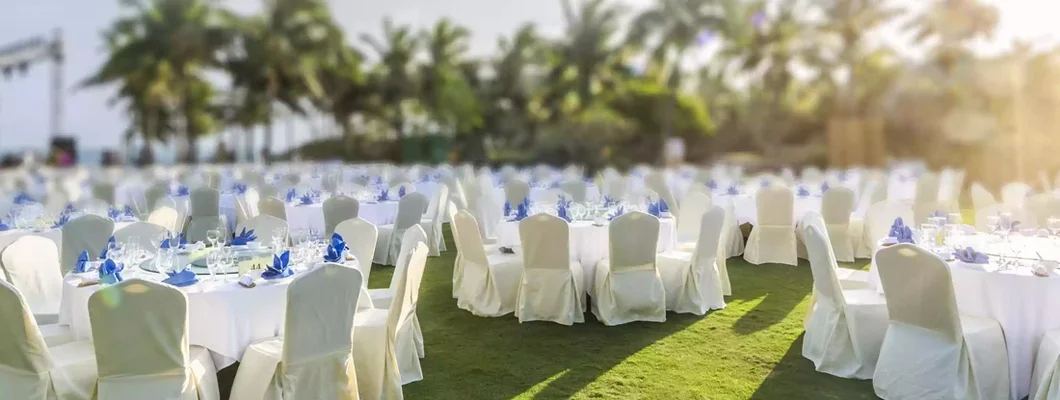 Preparation for a sunset dinner event at a resort. Find Equipment Rental Insurance.