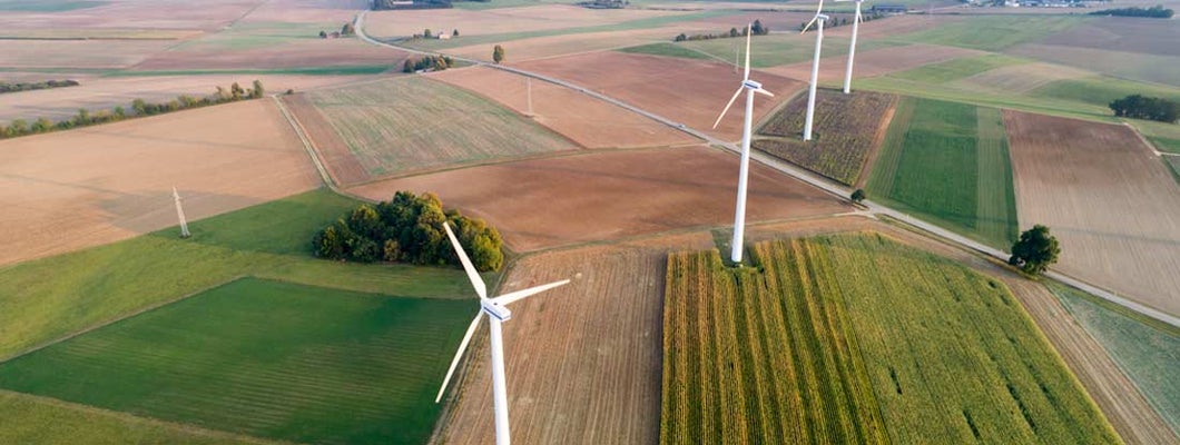 Aerial view of wind turbines. Insure windmills on property. 