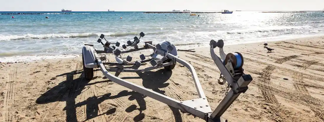 Trailer for boats on beach. Get Trailer Insurance Quotes.