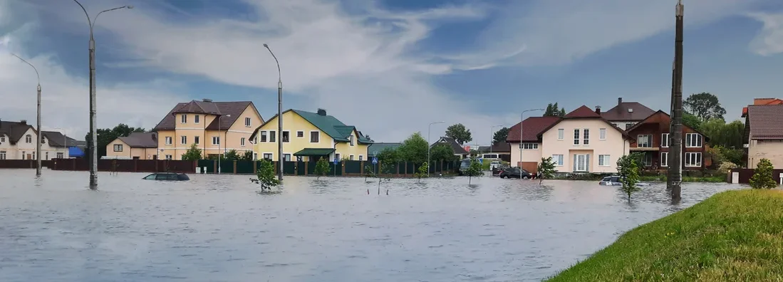Flooded streets of neighborhood. Find Maine Flood Insurance.