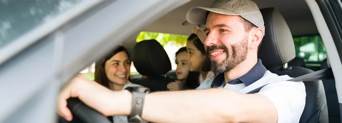 Husband driving family on vacation. Find East Providence, Rhode Island car insurance.