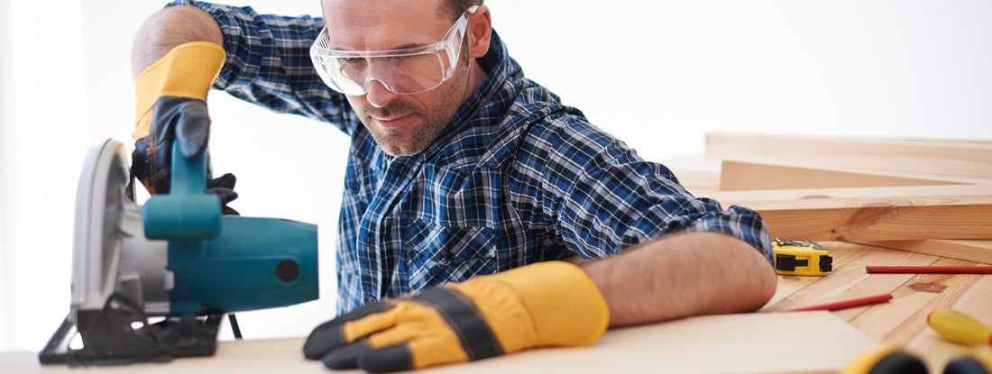 Contractor using electric saw