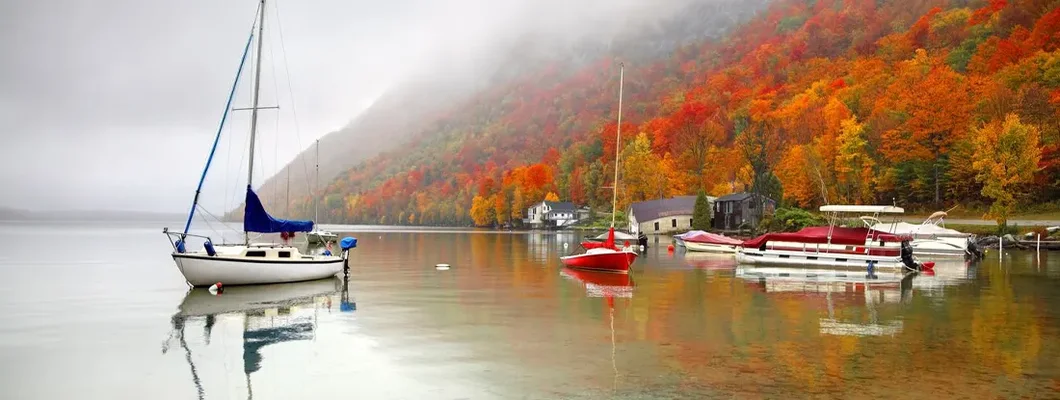Foggy autumn morning on Lake Willoughby. Find Vermont Boat Insurance.