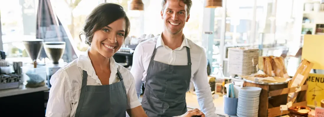 Staff Working At Delicatessen Checkout. Glendale, Arizona Business Insurance. 