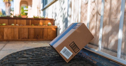 Cardboard package delivery at front door. 7 Tips and Tricks to Help You Prevent Package Theft. 