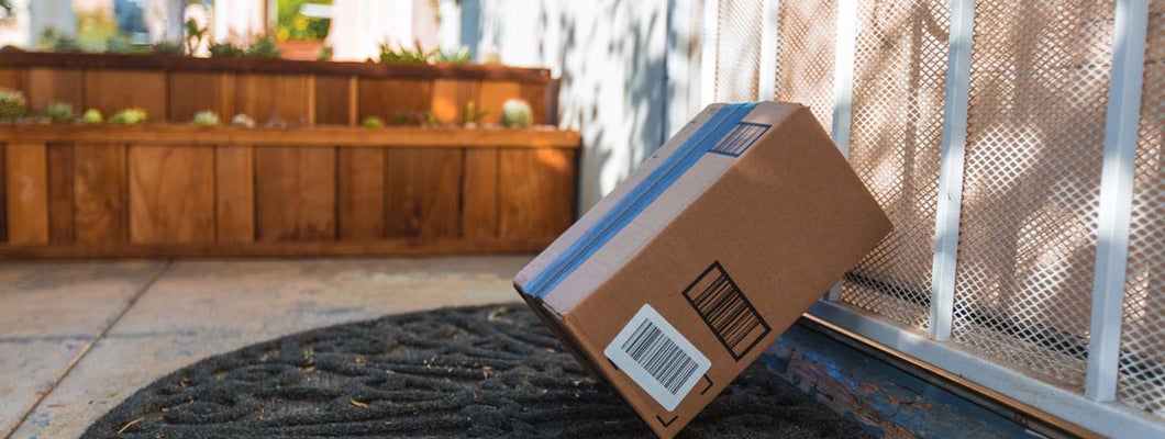 Cardboard package delivery at front door. 7 Tips and Tricks to Help You Prevent Package Theft. 