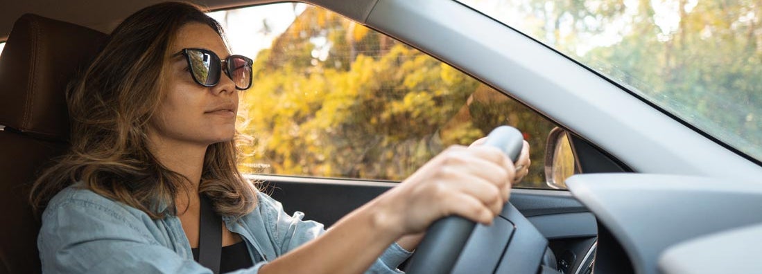 Woman driving in Toledo, Ohio. Find Toledo Ohio Car Insurance.