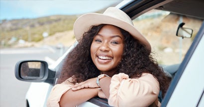 Happy face of woman in car. What Insurance is Needed for a Leased Car?