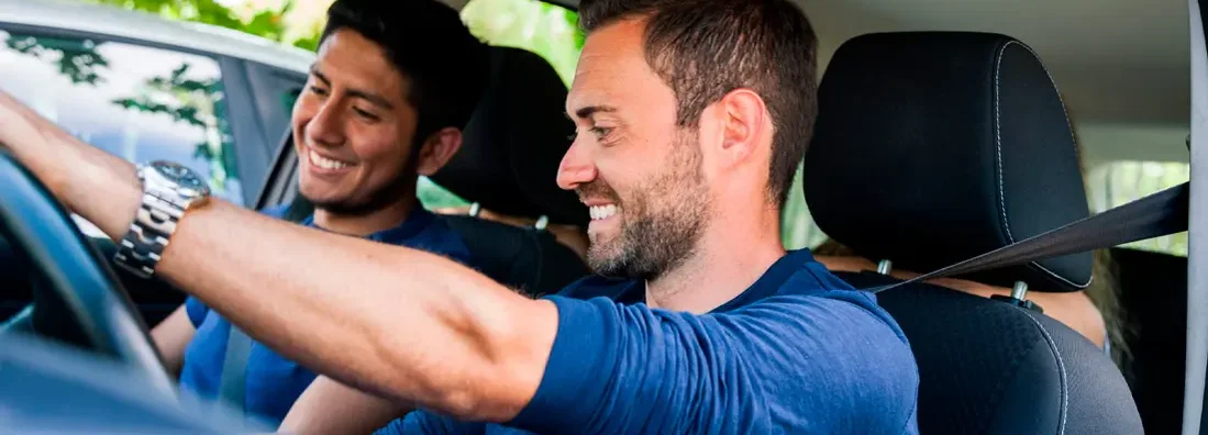 Friends sitting in the car ready to start vacations. Find Bellaire, Texas car insurance.