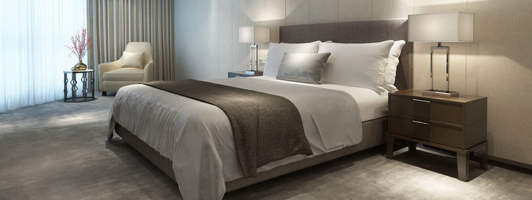 Contemporary modern luxury hotel bedroom. Find hotel insurance.