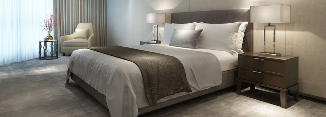 Contemporary modern luxury hotel bedroom. Find hotel insurance.