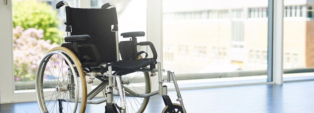 Wheelchair indoors at hospital. Find Total and Permanent Disability Insurance.