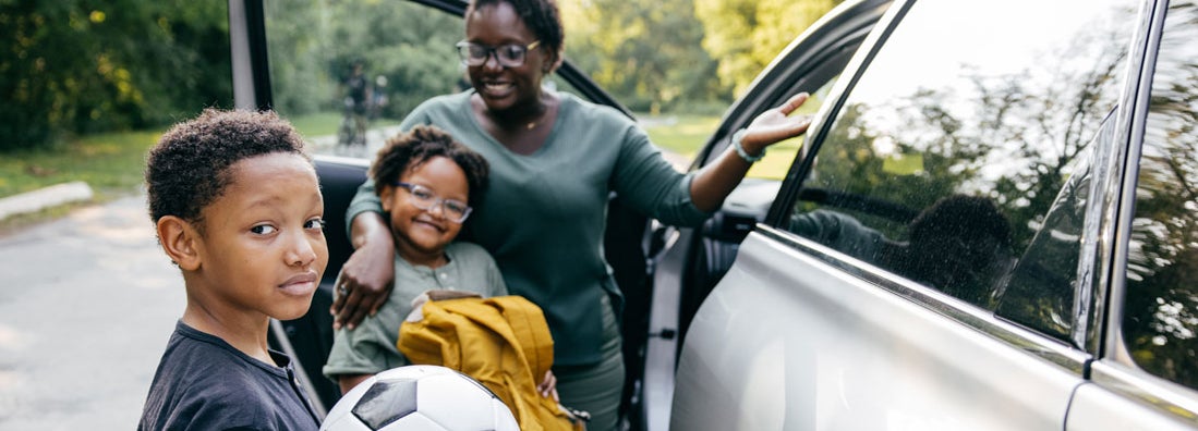 Family getting ready to go on their road trip together. Find Charlotte North Carolina car insurance.