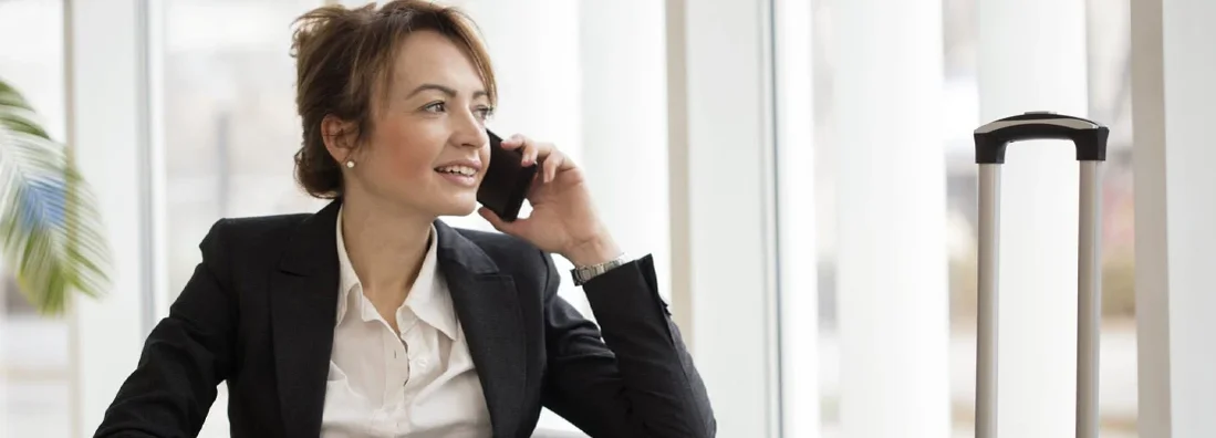 Businesswoman in an airport lounge. Find Los Alamos, New Mexico business insurance.