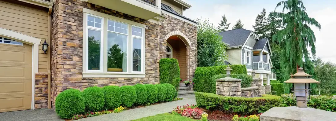 Beautiful curb appeal of American house with stone trim. St. Charles, Missouri Homeowners Insurance.