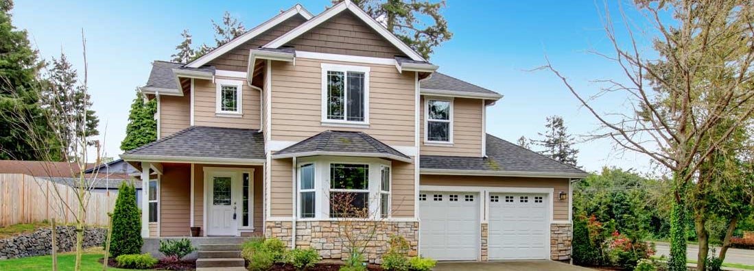 Beautiful beige siding house with stoned base. Find Philadelphia homeowners insurance.