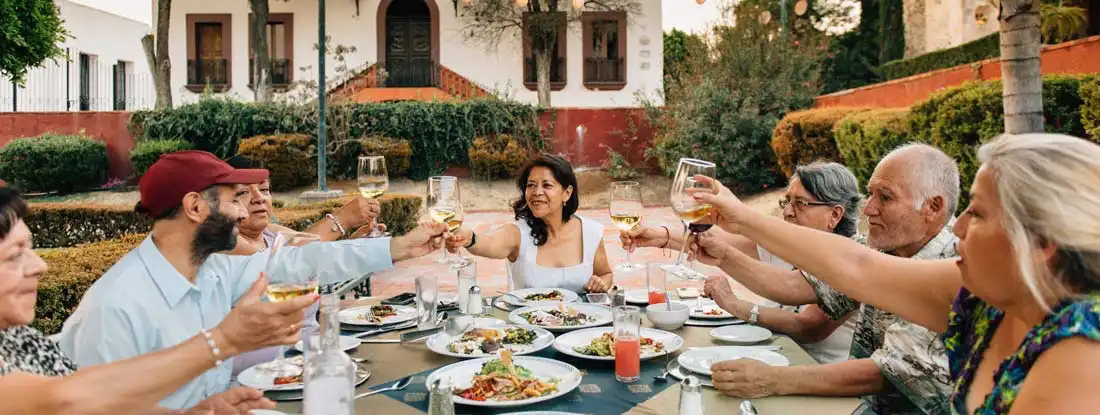 Group of people enjoying a meal together. Arizona Event Liability Insurance.