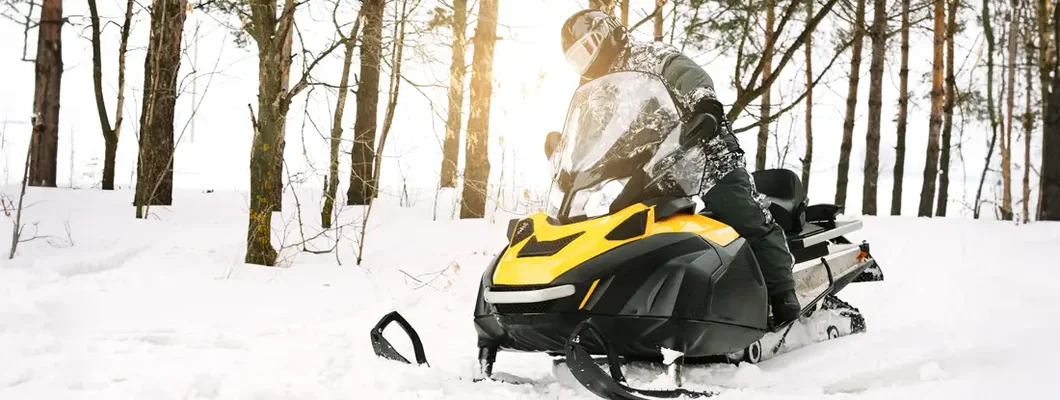Man on snowmobile. Find Snowmobile Liability Insurance.