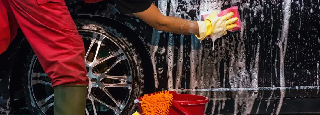 Man washing car. Find the Best Car Insurance in La Vista, Nebraska at an Affordable Rate.