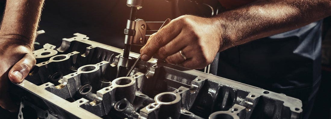 Repairing V10 engine in auto repair shop. Find Diesel engine repair service insurance.