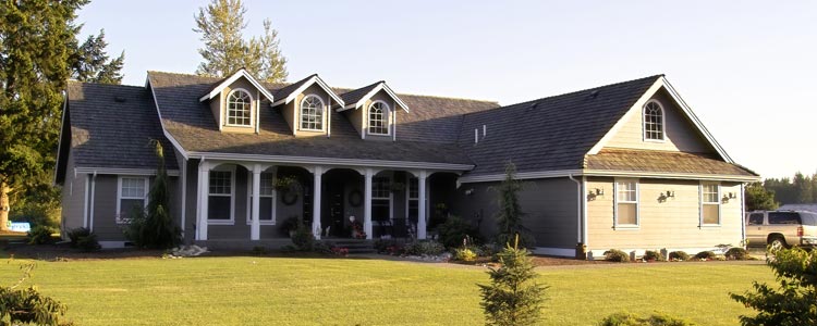 large house with suburban in the driveway