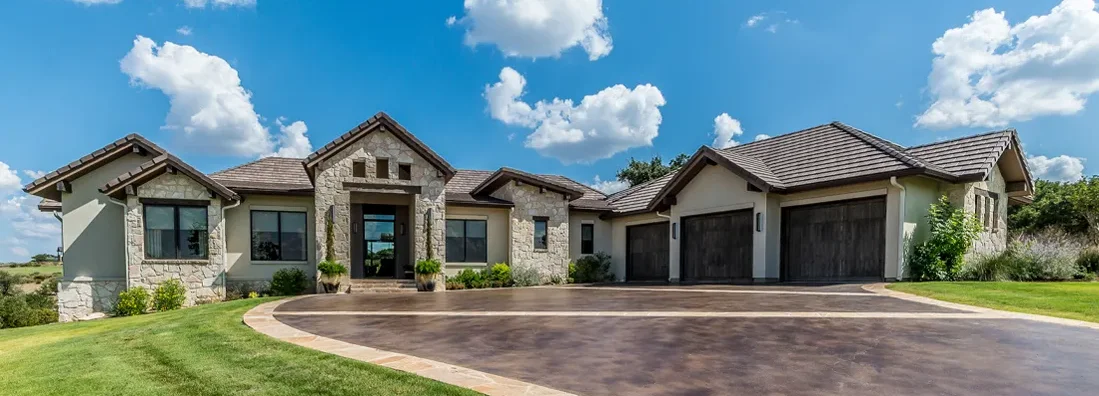 Decorated concrete on driveway of new home. How to Find the Best Homeowners Insurance in Cumberland Hill, Rhode Island.