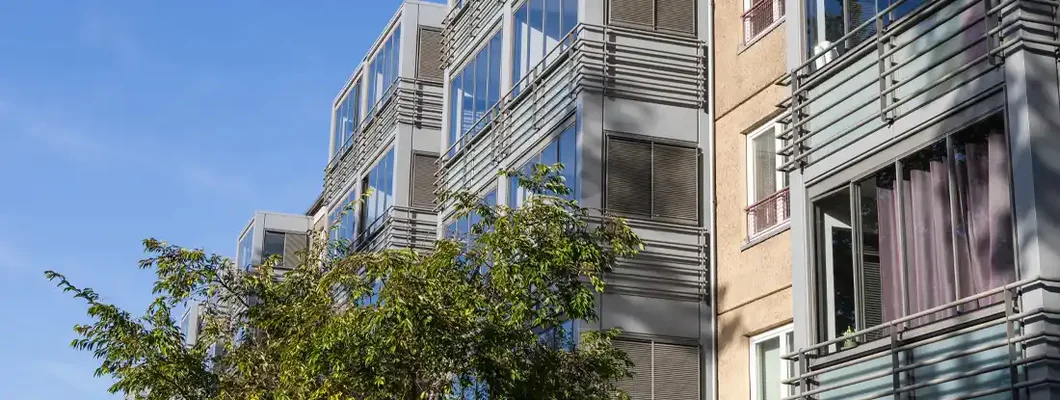 Facade of a modern residential building. Renters insurance cost.