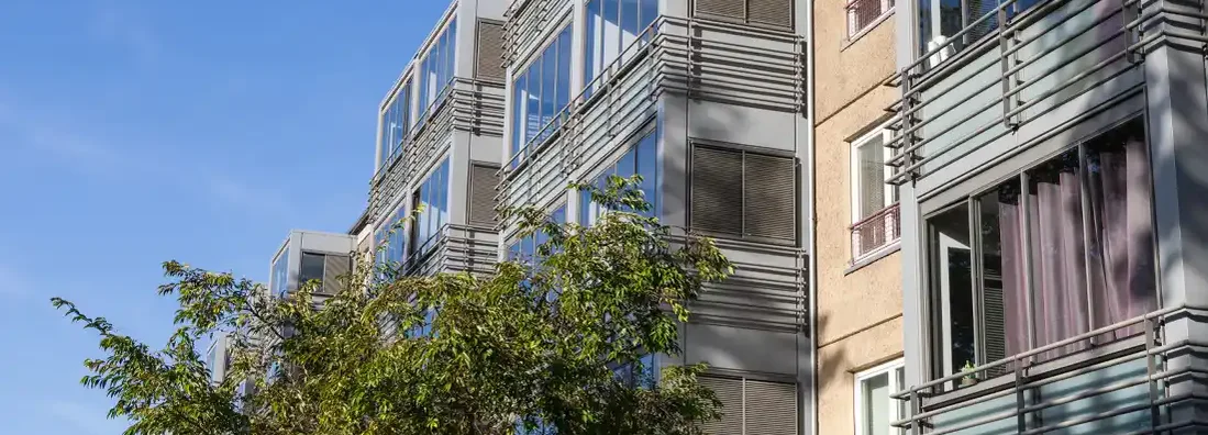 Facade of a modern residential building. Renters insurance cost.