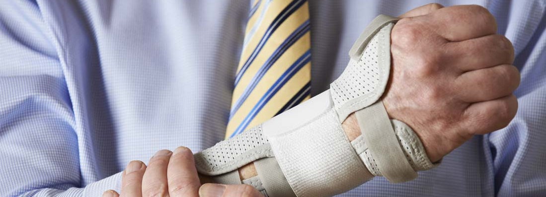 Businessman Suffering With Repetitive Strain Injury. Average Nerve Damage - Workers Compensation.