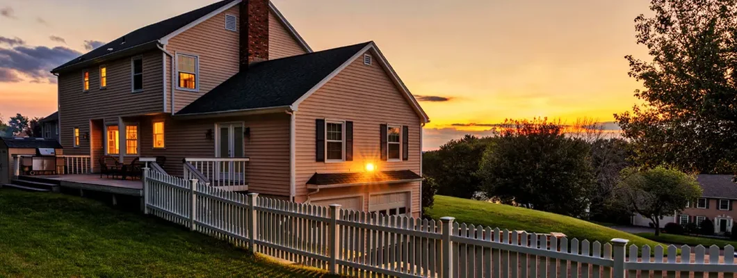 Beautiful colonial American house at sunset. How to Find the Best Homeowners Insurance in Houlton, Maine. 