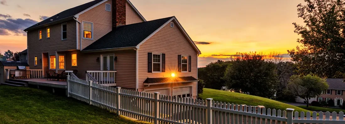 Beautiful colonial American house at sunset. How to Find the Best Homeowners Insurance in Houlton, Maine. 