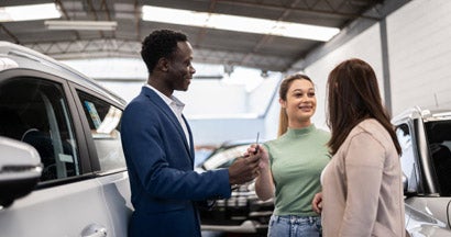 Mother and daughter buying a car in a car dealership. Can You Return a New Car?