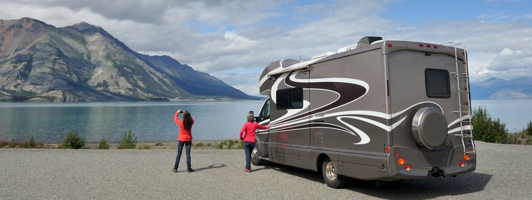 Mother and daughter traveling by RV in Yukon and Alaska. Find Alaska RV Insurance.
