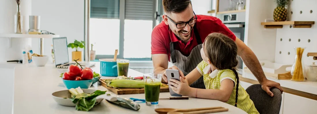 Father and daughter are in kitchen. How to Find the Best Homeowners Insurance in Dunwoody, Georgia.