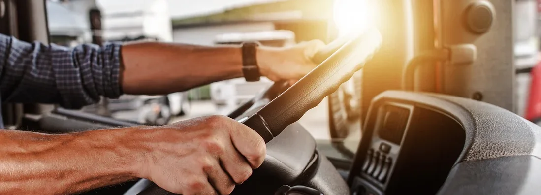 Commercial Driver Inside His Truck. Louisiana Commercial Vehicle Insurance.