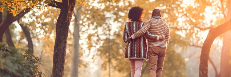 Couple walking in autumn park