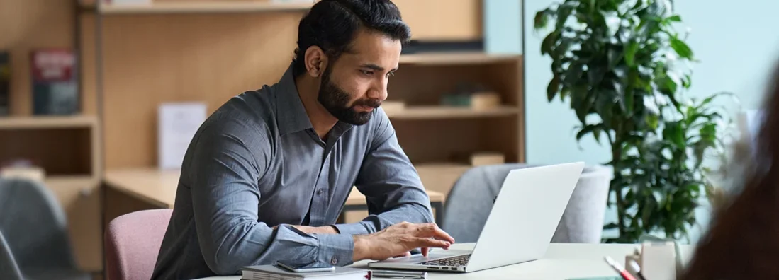 Man working on laptop at home office. Compare Landlord Insurance.