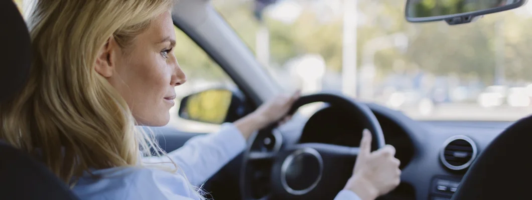 Businesswoman driving car. Shorewood, Wisconsin Car Insurance. 