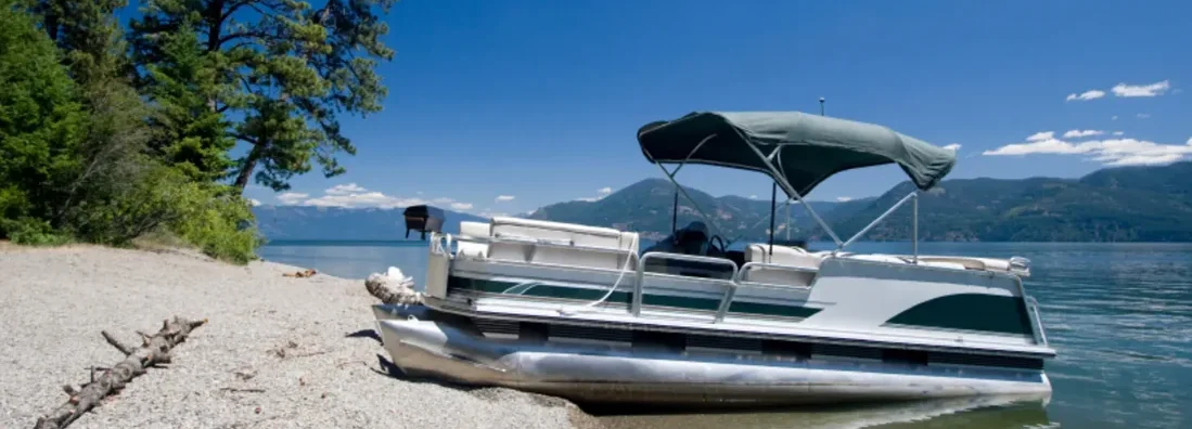 Pontoon on lake. Find Idaho Boat Insurance.