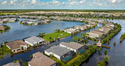 Flooded houses from Hurricane Debby rainfall water in residential community in Sarasota, Florida. Does Home Insurance Cover Hurricanes and Flood Damage?